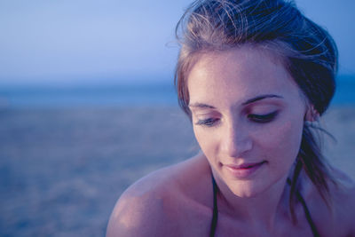 Close-up of beautiful woman at beach