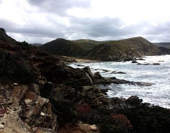 Scenic view of sea against cloudy sky