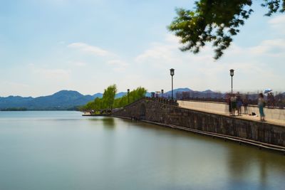 View of bridge over calm sea