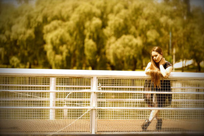 Full length of a woman against blurred trees