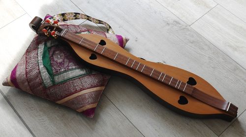 High angle view of guitar on table