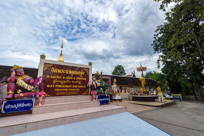 View of statues against cloudy sky