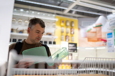Portrait of young woman using laptop