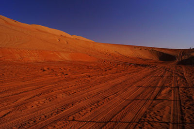 Dirt road passing through desert