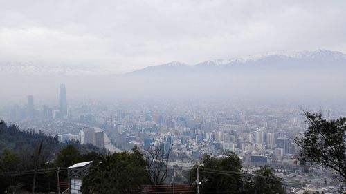 City and mountains in foggy weather