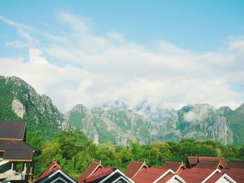 Houses on mountains against sky