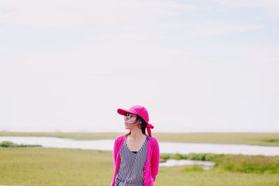 Young woman standing in park
