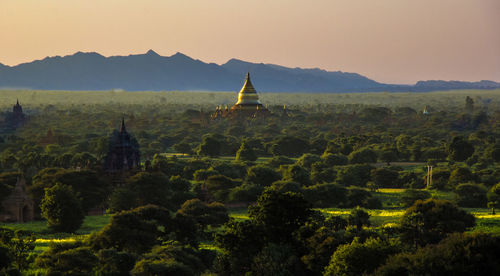 Panoramic view of temple and building against sky