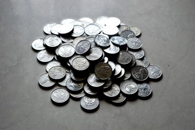 High angle view of coins on table