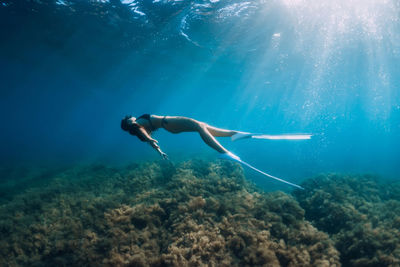 Woman swimming in sea