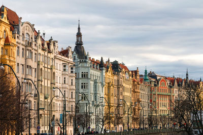 Buildings in city against sky