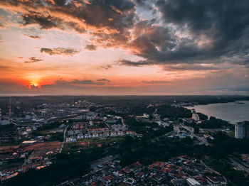 High angle view of buildings against sky during sunset