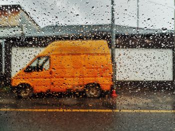 Raindrops on glass window during rainy season