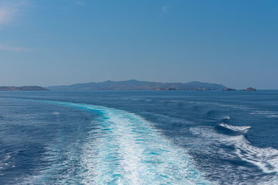 Scenic view of sea against clear blue sky