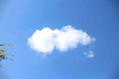 Low angle view of heart shape against blue sky