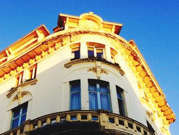 Low angle view of building against blue sky