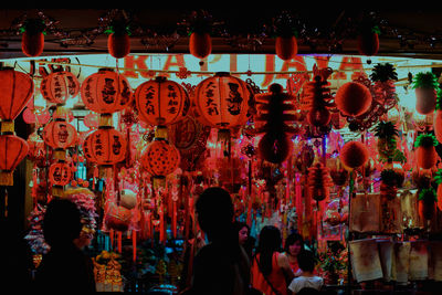 Group of people at illuminated lanterns