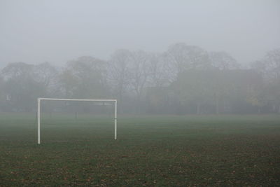 Goal post on playground in foggy weather