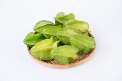 Close-up of green beans against white background