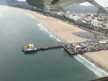 High angle view of bridge over sea in city