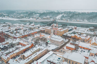 High angle view of city buildings during winter