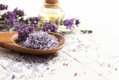 Close-up of purple flower in vase on table