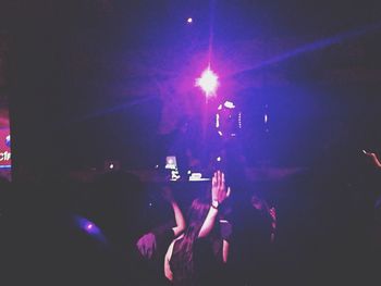 People enjoying music concert