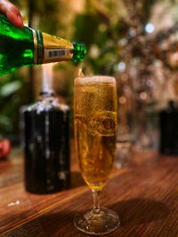 Close-up of beer glass on table