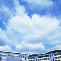 Low angle view of building against cloudy sky