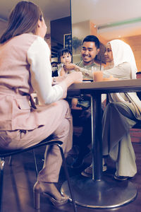 Young couple sitting on chair