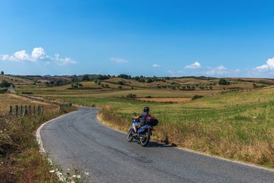 Road passing through field