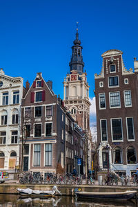 Low angle view of buildings against blue sky