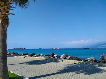 Scenic view of sea against clear blue sky