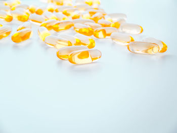 Yellow pills with with cannabis oil . macro photo with copy space.