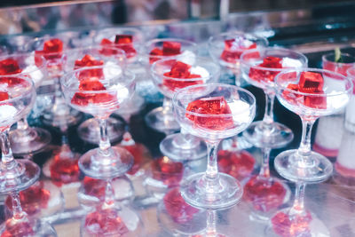 Close-up of wine glasses on table