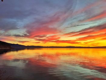 Scenic view of sea against romantic sky at sunset