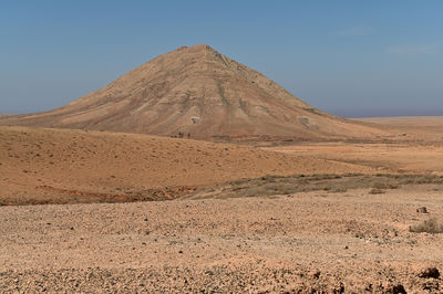 Scenic view of desert against clear sky