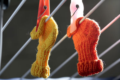 Close-up of knitted socks drying on clothesline