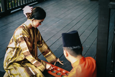 Midsection of woman using mobile phone