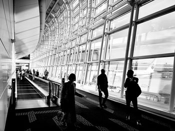 People walking on railroad station platform