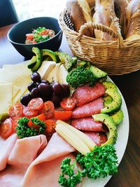 High angle view of fruits in basket on table