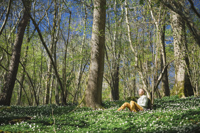 Woman relaxing in forest