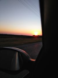 Sunset seen through car windshield
