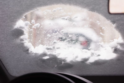 Close-up of snow on car windshield