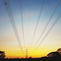 Low angle view of trees against sky during sunset