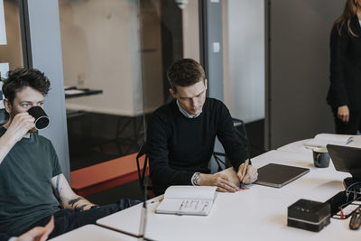 Business colleagues working in office