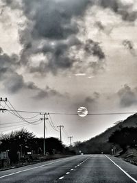 Cars on road against sky