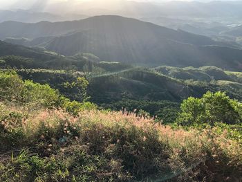 Scenic view of landscape and mountains against sky