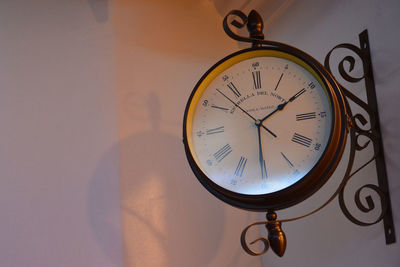 Close-up of clock on wall