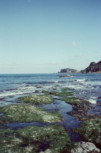 Scenic view of sea against clear blue sky